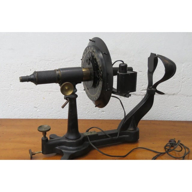 This antique ophthalmometer is made out of cast iron and brass, and it is in good condition. This machine was made by...