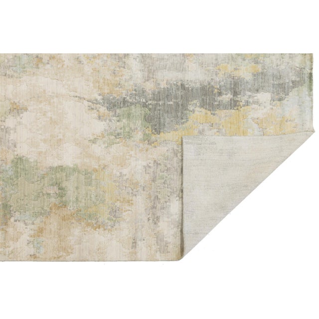 Transform your contemporary living space with this modern abstract area rug, featuring a fluid, watercolor-inspired design...