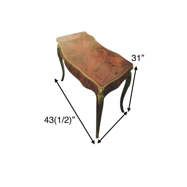 This French Style Inlaid Floral Marquetry Writing Desk is a rare and unique piece that exudes elegance and charm. The...