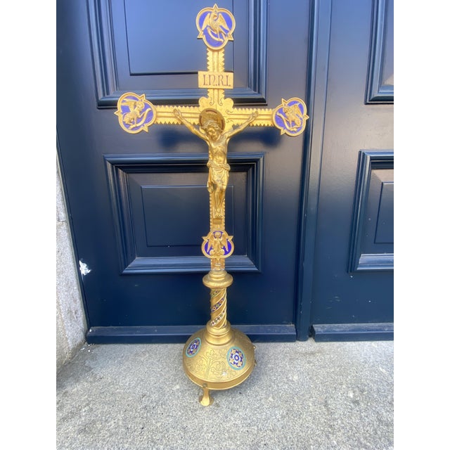 A high-quality altar crucifix, probably dating from the late 19th or early 20th century. At the four ends of the cross are...