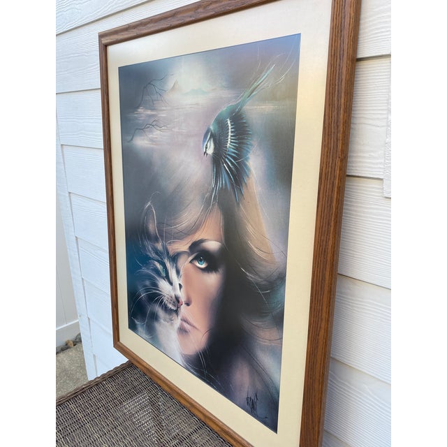 Elevate your space with this captivating, oversized 1980s vintage fantasy art print titled "Cat Bird Woman" by renowned...
