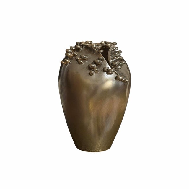 The Cascading Reef Vase from Studio A by Global Views is a sculptural statement piece handcrafted in Italy. Finished in a...