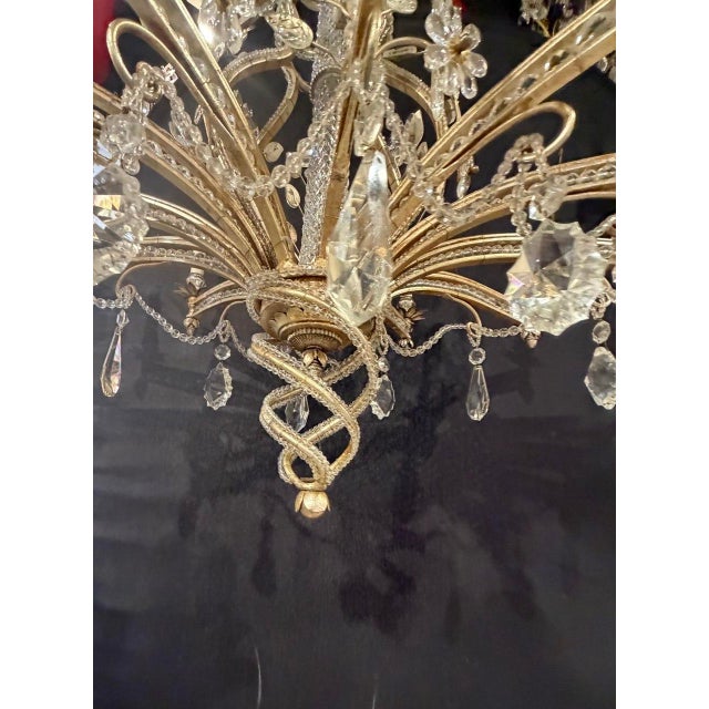 Circa 1940's silver leaf finish 12 lights chandelier with beaded crystals and cut crystal body