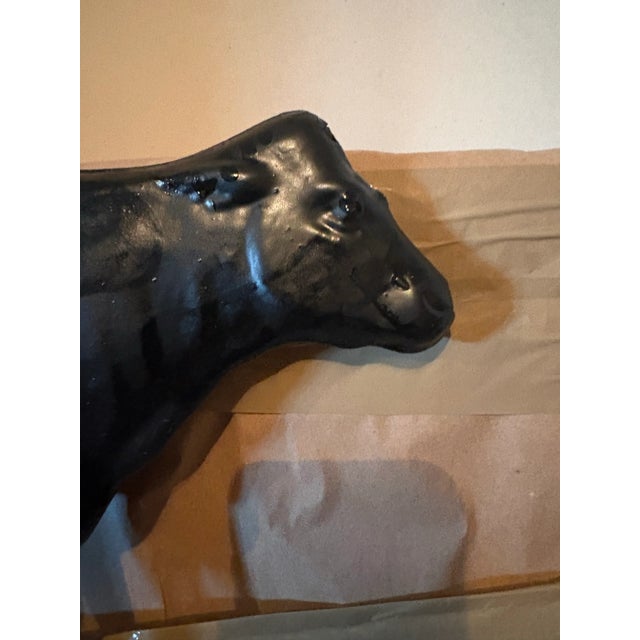 Wonderful vintage copper weathervane painted black with a hollow center, together with armature for mounting. The cow...