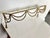 Metal wall shelf featuring gilded swagged rope and two tassels. Glass shelf. Great in a powder room. Most items found at...