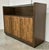 Original retail $2869, stylish Modern Wood and Cooper Three Door Bar Cabinet, four glass shelves, two wood shelves, one...
