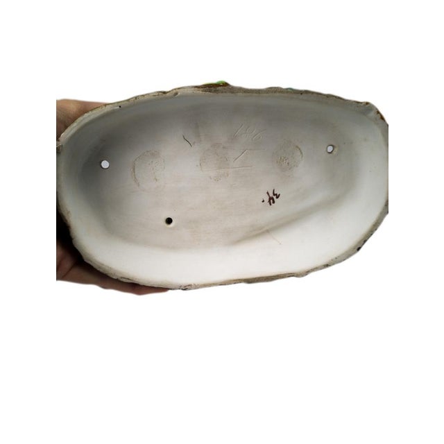 A graceful porcelain inkwell station, crafted from Meissen porcelain, features two inkwell compartments. The piece...