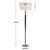 The Tuxedo Floor Lamp features a tapered metal stem finished in a sleek satin black, accented with brass plated details....