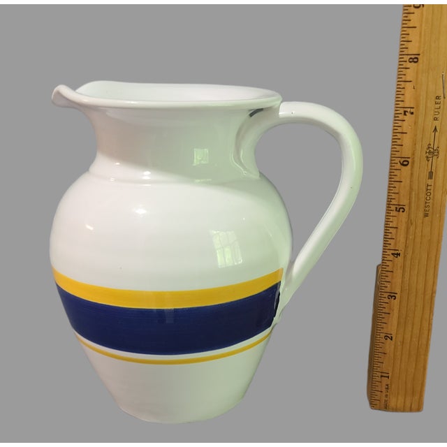This vintage Italian pottery pitcher is a beautiful addition to any Mid-Century Modern collection. The hand-painted blue...