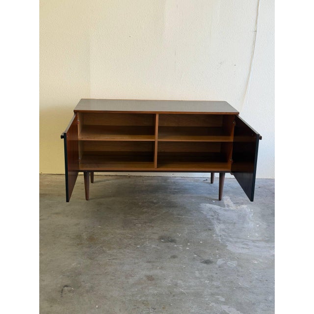 Beautiful vintage Danish rosewood sideboard featuring striking bookmatched grain and clean mid-century modern lines. This...