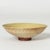 Beautiful “Farsta” bowl by Wilhelm Kåge, in delicate stoneware with natural tones. Yellow inside, outside with red streaks...