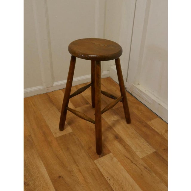 A Victorian Beech and Elm High Studio Stool A lovely country piece, and very useful, the stool is good and sound, with...
