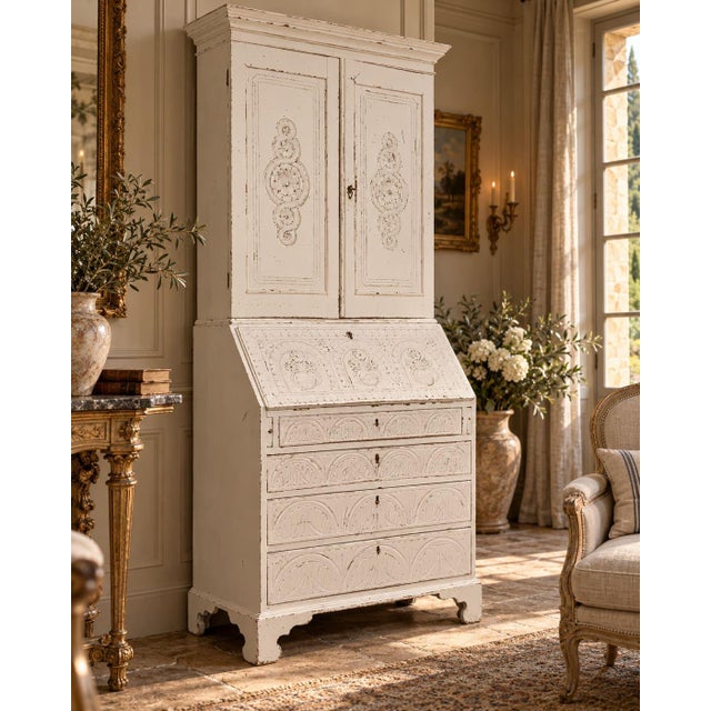 An elegant late 19th-century trumeau-style bookcase/desk, crafted from solid oak and embellished with refined bas-relief...