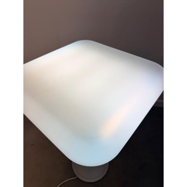 Sculptural bianca floor lamp by ligne roset , featuring a beautifully soft, organic form and a minimalist pedestal base....