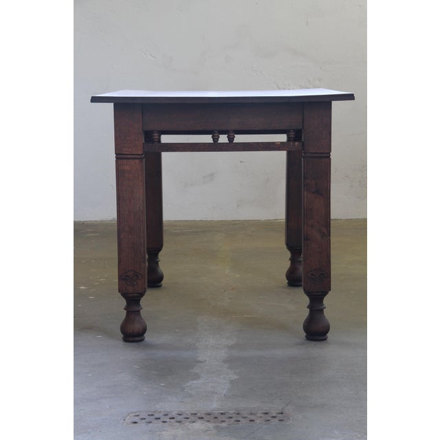 Danish farmhouse table in oak from the begining of the 20th century. Shows a simple and solid design. It has a clean shape...