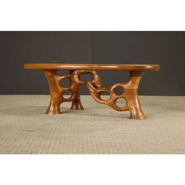 Presenting a mesmerizing free-form coffee table crafted by California artisan Craig Lauterbach, signed and dated 1980....