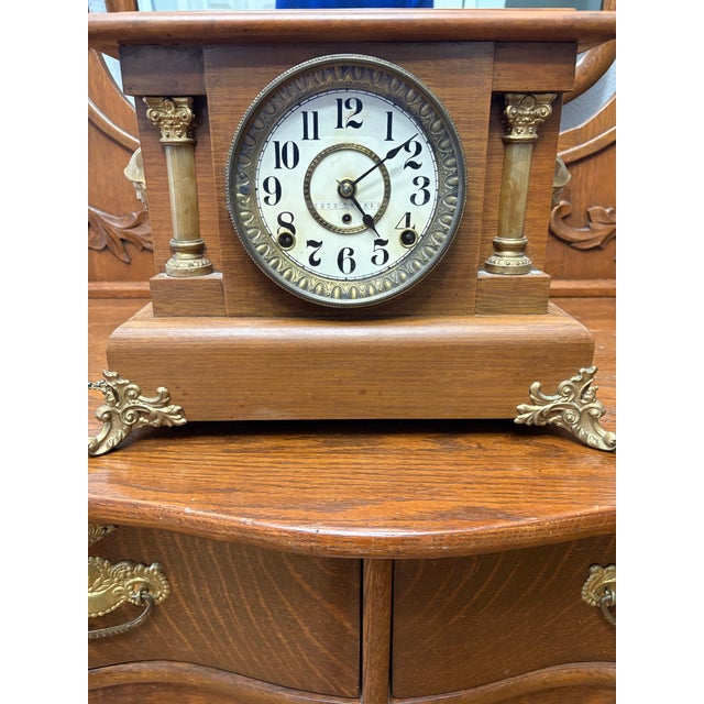 Antique Seth Thomas Adamantine mantel clock, circa 1900–1910, featuring classic column design with tiger oak finish and...