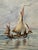 Original watercolor on paper depicting a traditional sailing vessel underway on calm open water beneath an expansive...