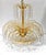 A vintage, mid-century modern waterfall chandelier in gold brass, with crystal lusters. The top tier has chains of small...