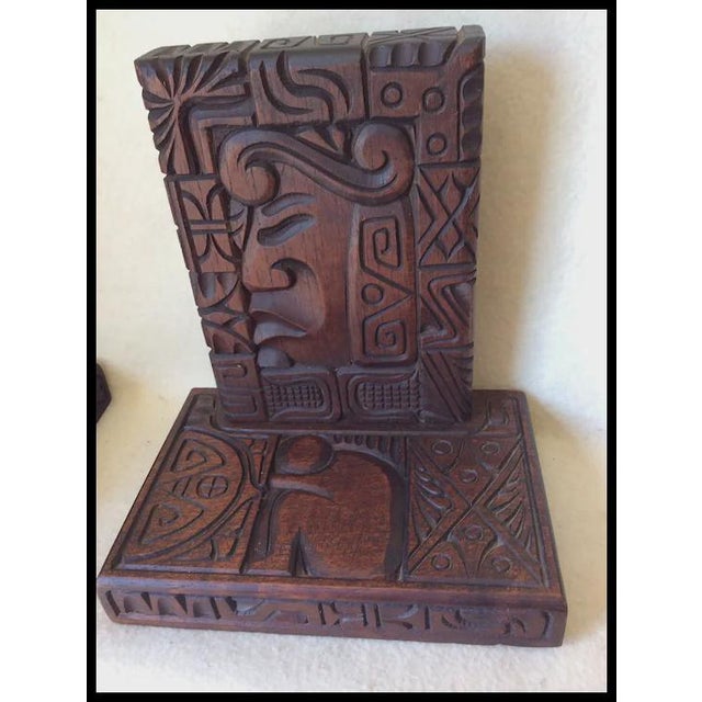 A pair of vintage hand carved Ethnographic, Honduran Bookends. The Bookends are hand carved wood and are decorated with a...
