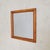 A 1950s Italian wall mirror with a soft, architectural presence. Framed in solid wood, its rectangular form features...