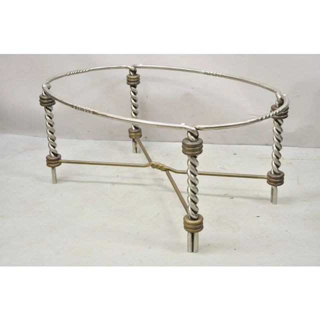 Vintage Italian Neoclassical Style Steel and Bronze Twisted Metal Oval Coffee Table. Item features heavy steel and bronze...