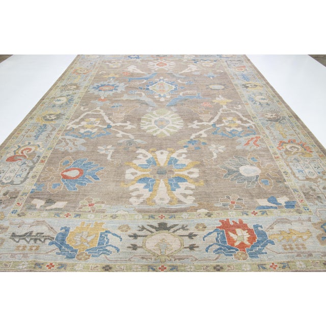 This contemporary sultanabad oriental rug, featuring a central medallion surrounded by symmetrical floral and geometric...