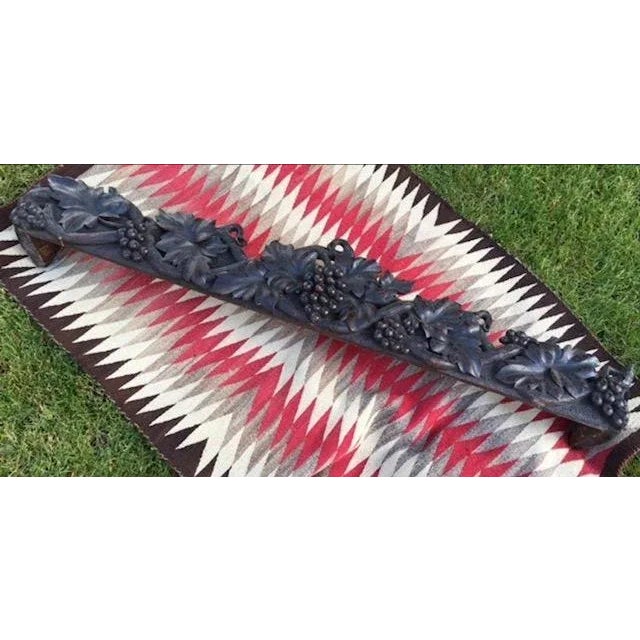 An early 1900s Black Forest carved wood cornice with grape relief — intricate foliate carving from Germany. Measures 58"W...