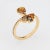 Stylish contemporary coloured diamond ring crafted in 18 karat yellow gold. The larger pear cut (orange) diamond is...