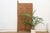 This 81.5-inch door (94 inches including its extended pivot post) is a monumental two-plank Yoruba piece, carved in the...