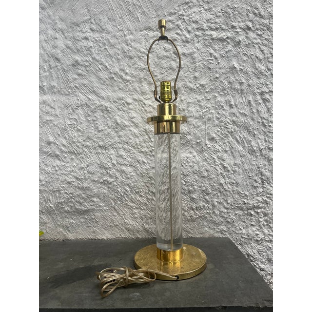 Large modern lamp with solid lucite cylinder with metal brass manufactured by Fredrick Cooper, Chicago. The original...