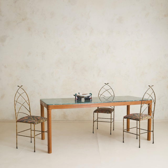Its commanding presence, stretching just over six feet in length, articulates this Italian dining table from the 1970s....
