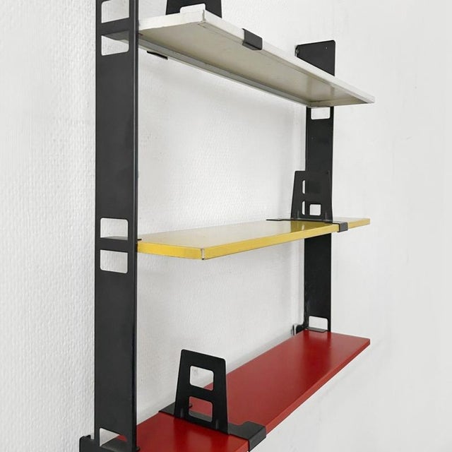 Tomado pocket steel shelf wall rack designed by D. Dekker & Van Mieren in the 1970s. This vintage wall rack has beautiful...