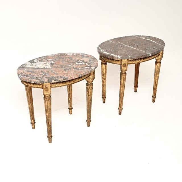 A gorgeous pair of antique French marble top gilt wood side tables. They were made in France and date from around the...