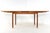 Attractive extendable teak dining table. The table can be extended using an ingenious system. Underneath the tabletop,...