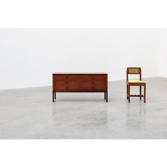 A Danish mid‑century modern chest of drawers, crafted in Denmark in the 1960s, distinguished by its refined proportions...