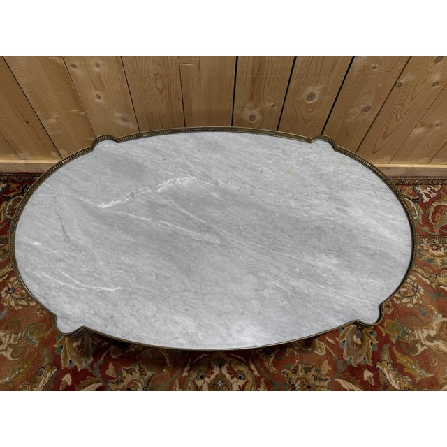 Louis XVI style bouillotte coffee table with "ears" (or "wings"). Made of solid mahogany with brass inlays and a rare blue...