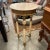 Tall round lamp table or side table with stone top and legs. It has a lot of bronze colored metal throughout the table and...