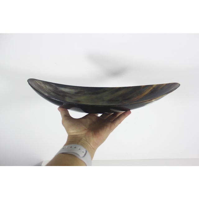 This is a bowl or dish made from natural horn. Very useful size. 13.75” long 4.75” wide 2.75” tall