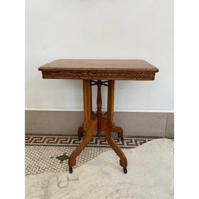Victorian Antique Victorian Carved Quarter Sawn Oak Parlor Table on Casters, Eastlake Style For Sale - Image 3 of 18