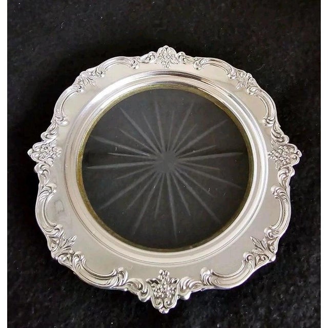 A refined vintage sterling silver trinket or bon bon dish, beautifully formed with a cut-glass interior and an ornate...