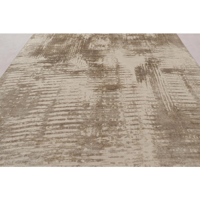 This magnificent 9x12 Abstract rug from Rug & Kilim’s Modern Collection is a minimalist, textural work of art, crafted...