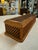 Beautiful vintage wooden jewelry box featuring an intricate woven wood exterior and a long, rectangular silhouette. The...