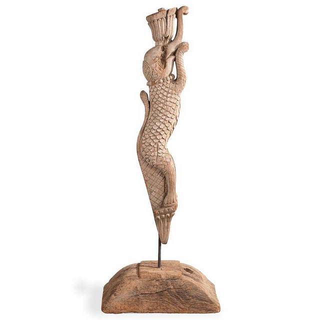 A striking hand-carved wooden yali from South India, mid to late 20th century. This temple fragment depicts an ancient...