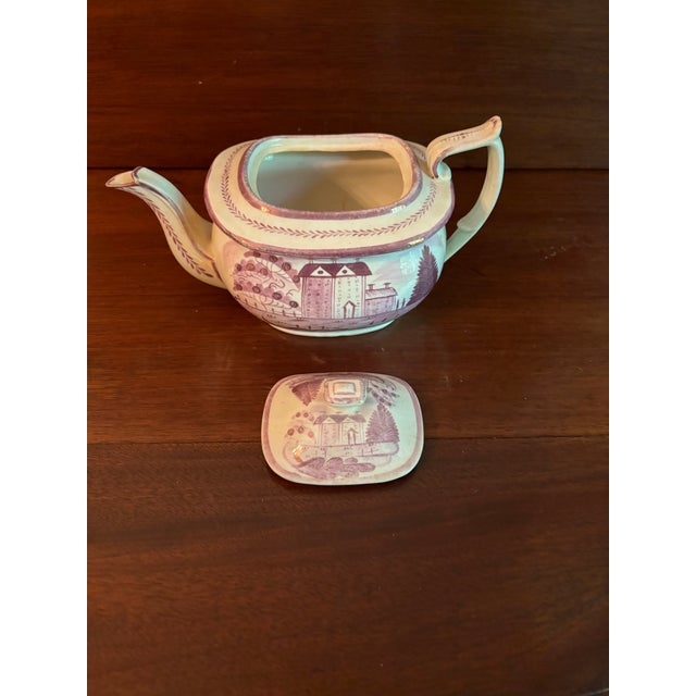 Pink luster-wear teapot school house pattern circa 1830s.