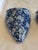 Sweet pair of blue and white wall pockets with integrated hanging hole. Floral design. No chips or cracks.
