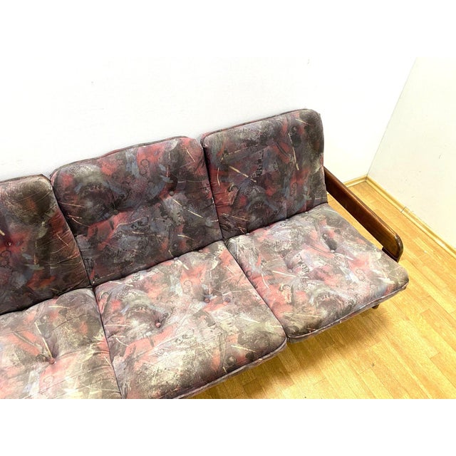 A stylish retro sofa produced in the second half of the 20th century, featuring a solid wooden frame, removable...