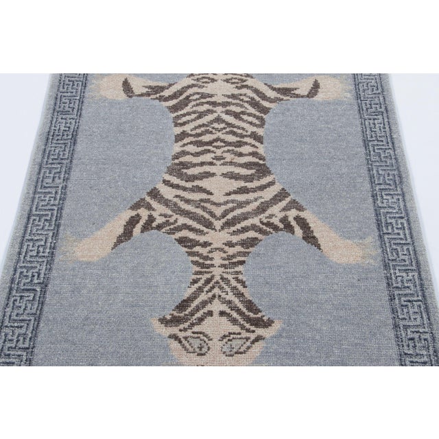 Hand-knotted in wool, this 3x6 runner rug is a striking new addition to our Distressed Homage collection, inspired by a...