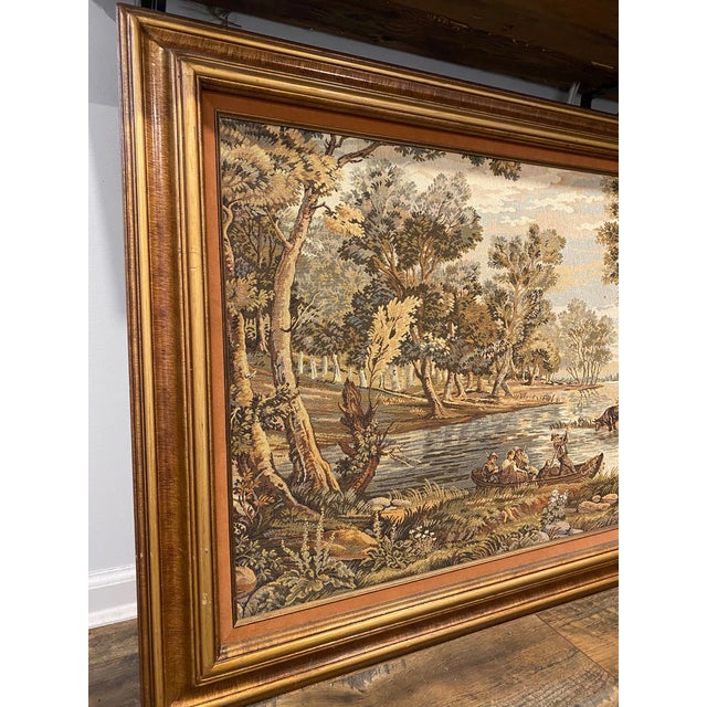 Stunning antique Italian tapestry featuring a detailed pastoral landscape scene with figures, trees, and water. Dating...