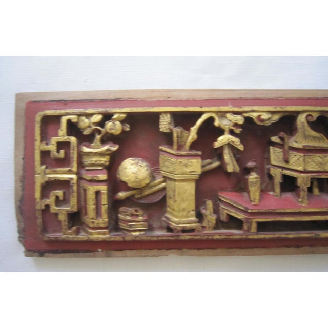 Gorgeous Chinese wood Temple carving with gilt accents. It measures 22"W x 6"H x 1"D. It has a single hanging hook on the...